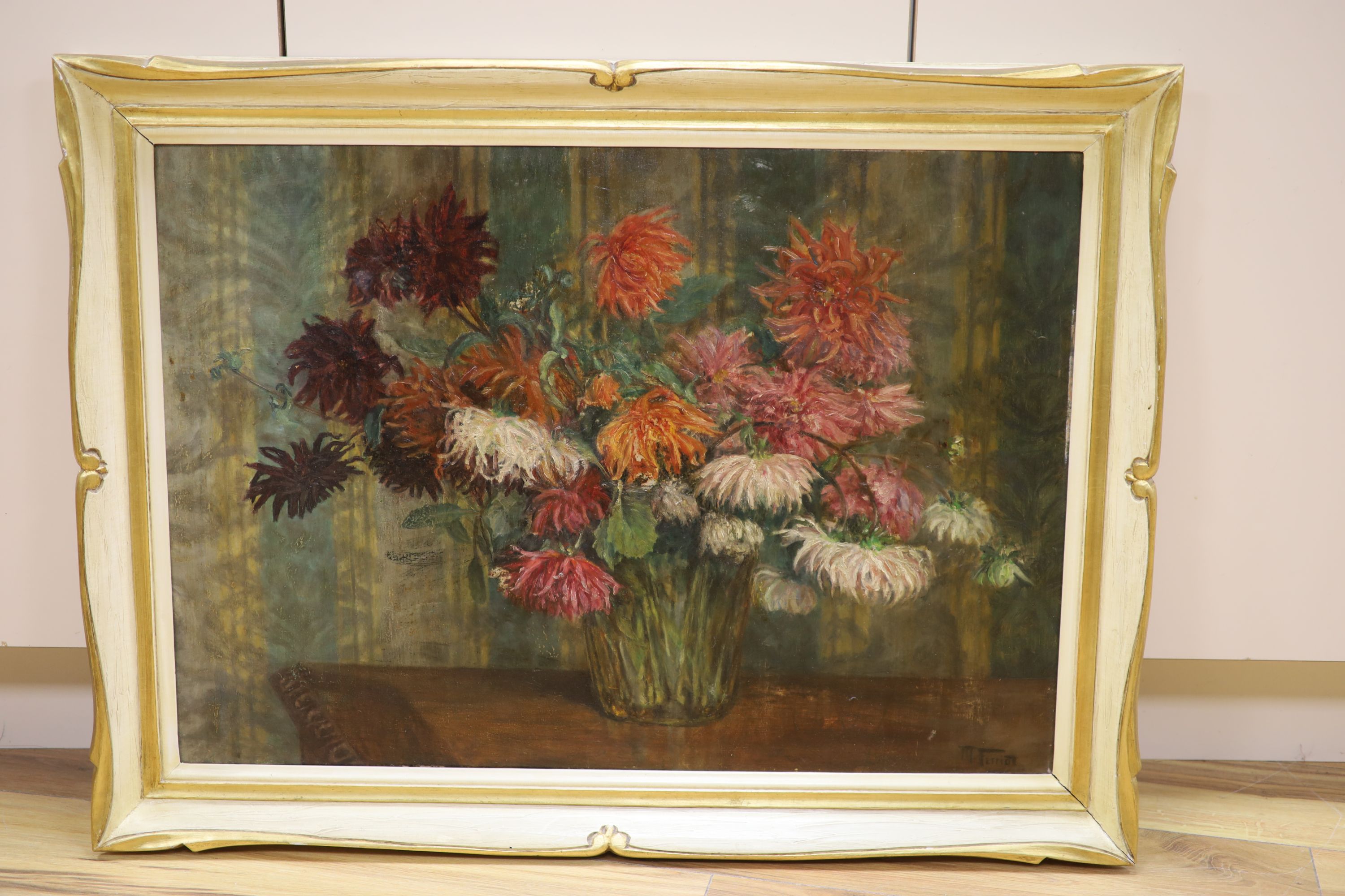 Early 20th century continental school, a still life study of dahlias, oil on board, signed lower right, 52 x 75 cm.